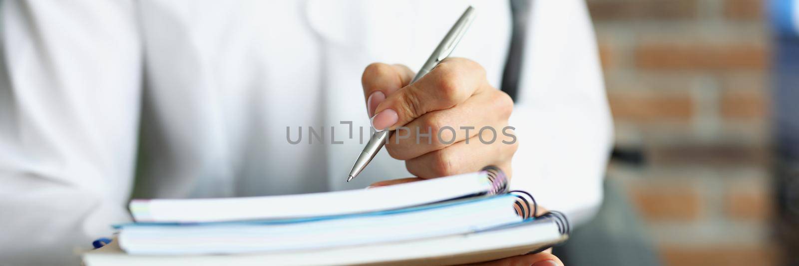 Close-up of student hold stack of books, prepare for exam in university or extracurricular. Woman with backpack, headset ready to learn. Knowledge concept