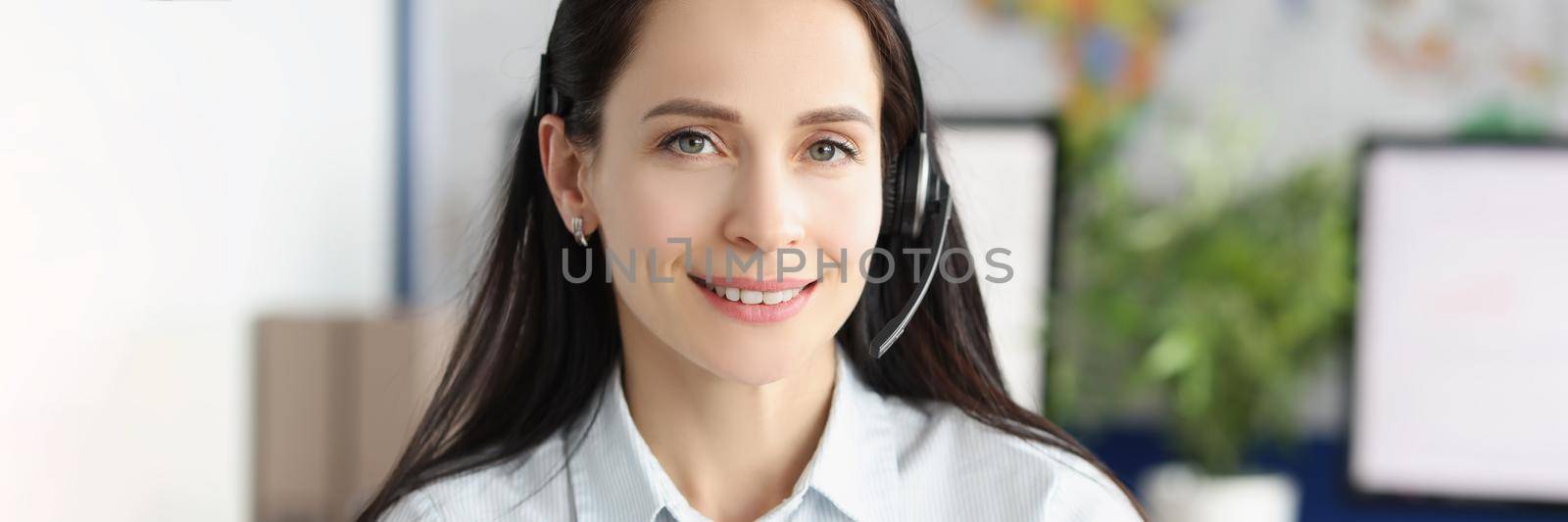 Portrait of lady support service worker wear headset with microphone for voice connection. Operator on line in office. Customer service, consultant concept