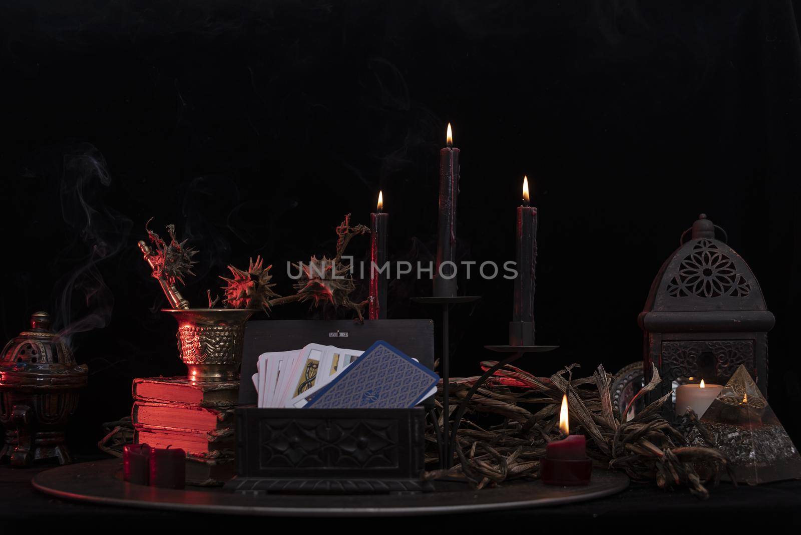 Witch laboratory with potion, elixirs, glass bottles, dry flowers, herbs and ingredients. Esoteric, wicca and occult background, fortune telling and divination ritual, mystic concept