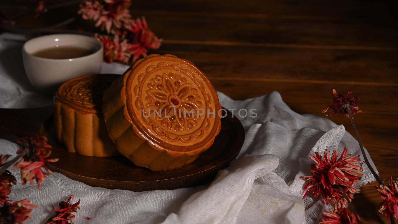 Tasty mooncakes for Mid autumn festival or Chinese traditional festival on wooden table.