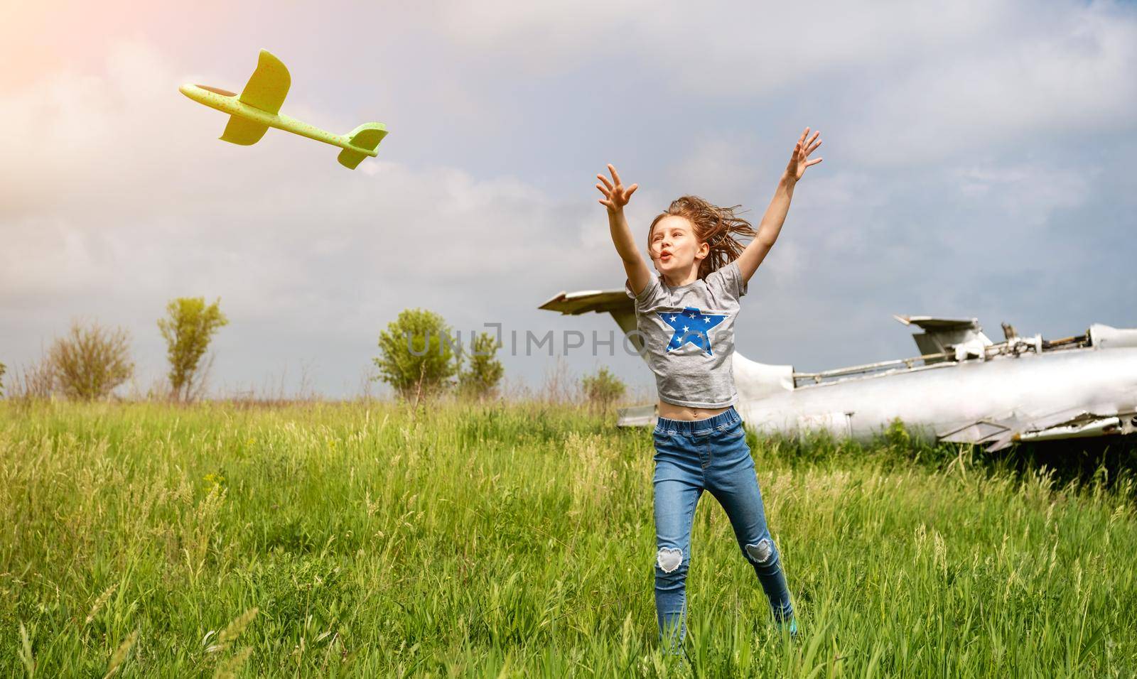 Child playing with toy plane by GekaSkr