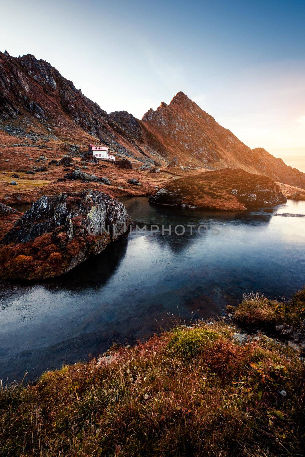 Scenic view of building in mountains by GekaSkr