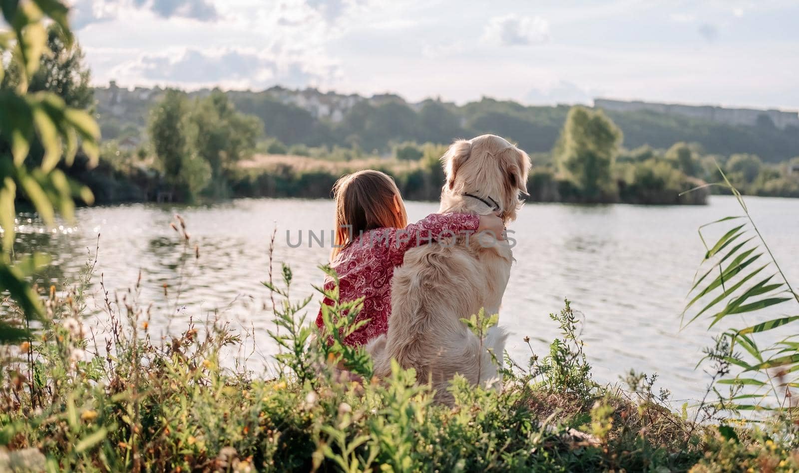 Child with golden retriever dog outdoors by GekaSkr