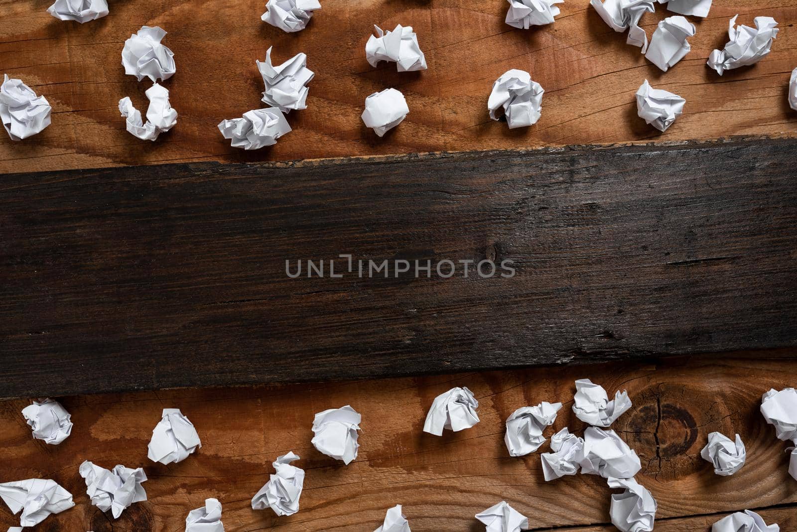 Important Informations Written On Piece Of Wood With Paper Wraps Around On Floor. Crutial Announcements On Wooden Panel With Crumpled Notes All Over. by nialowwa