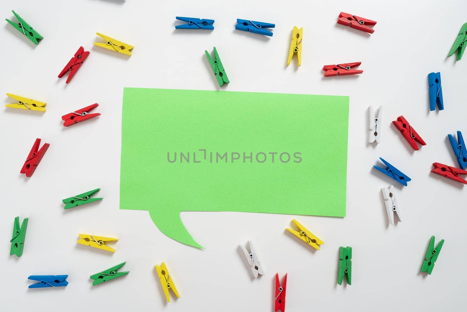 Colorful Pegs Placed Around Speech Bubble With Important Information.