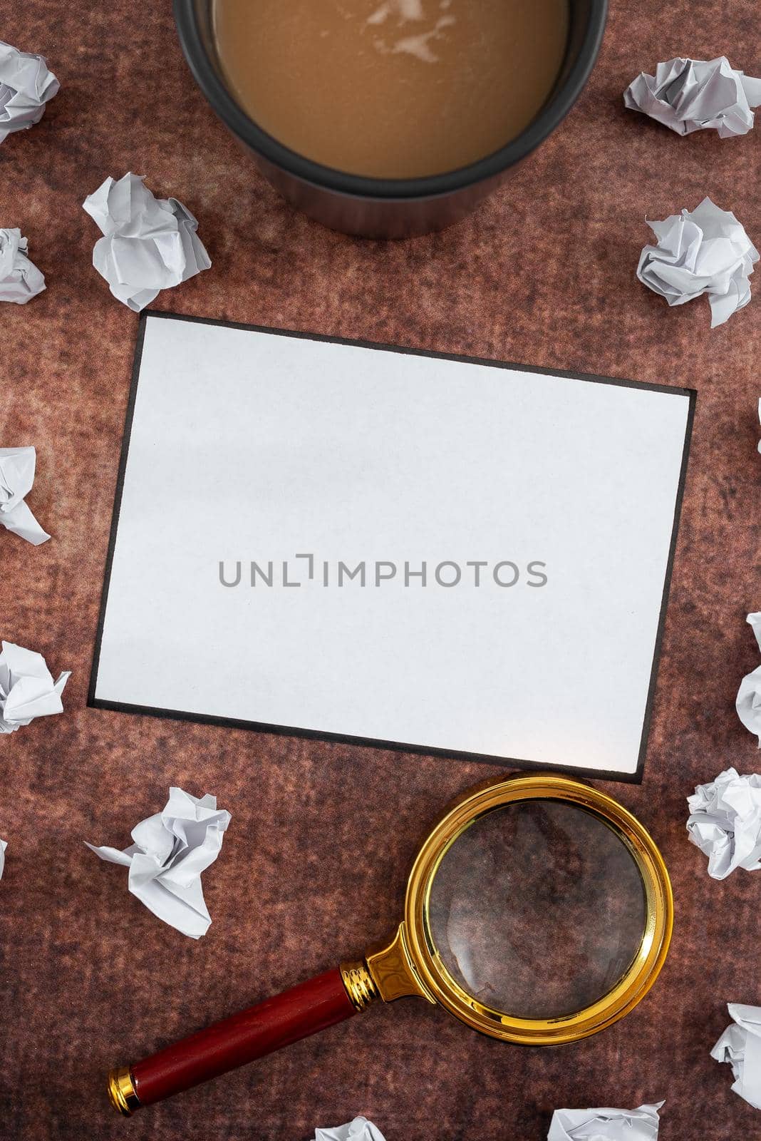 Blank Sheet With Magnifying Glass, Coffee Cup Surrounded With Crumpled Papers Over Wooden Background. It Is Presenting Analyzing Of Plans And Strategies For Business. by nialowwa