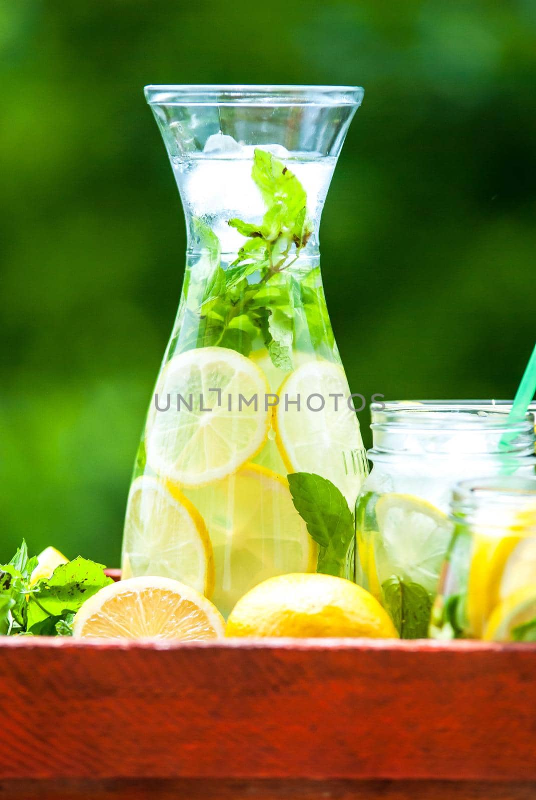 lemonad jars with mint and ice by maramorosz