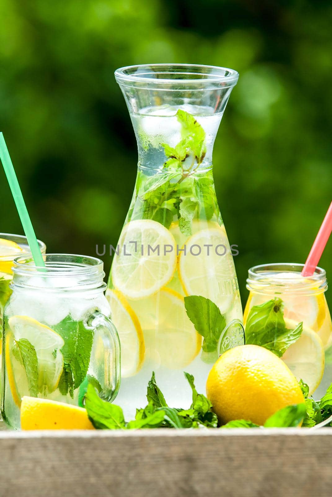 lemonad jars with mint and ice by maramorosz
