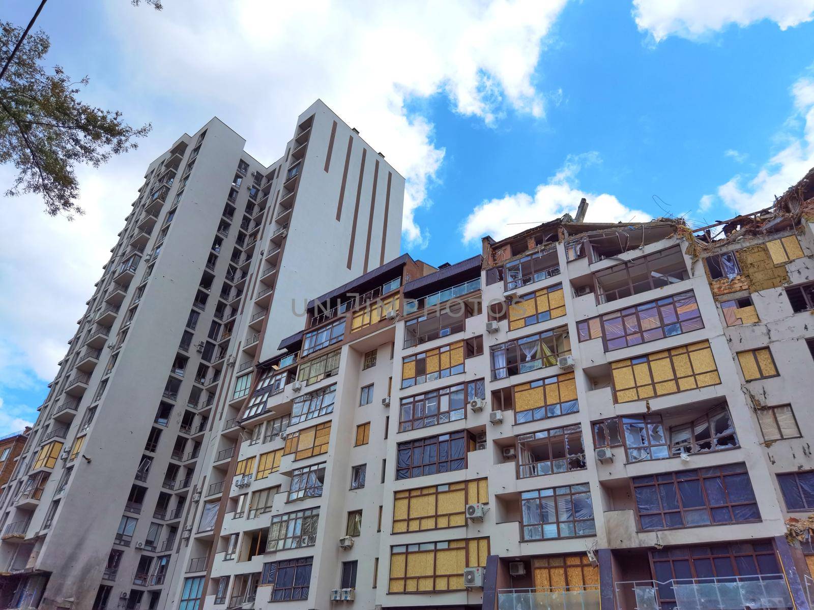 Kyiv, Ukraine - July 10, 2022: A residential building damaged by an russuian rocket in the Kyiv. The rocket hit the house.
