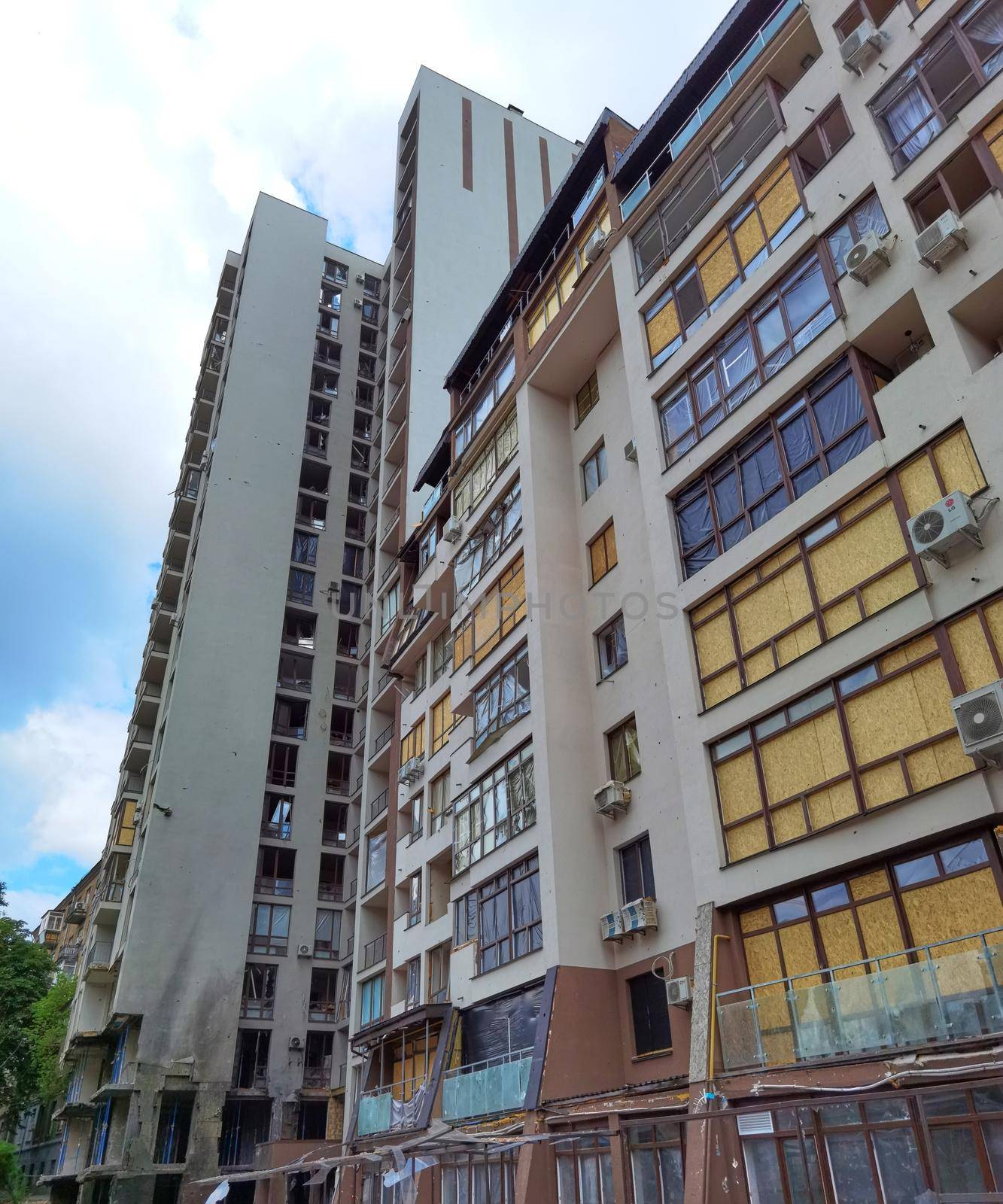Kyiv, Ukraine - July 10, 2022: A residential building damaged by an russuian rocket in the Kyiv. The rocket hit the house.