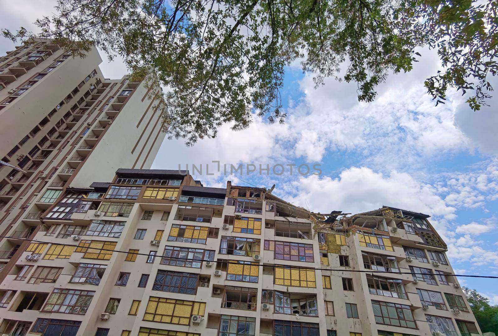 Kyiv, Ukraine - July 10, 2022: A residential building damaged by an russuian rocket in the Kyiv. The rocket hit the house.