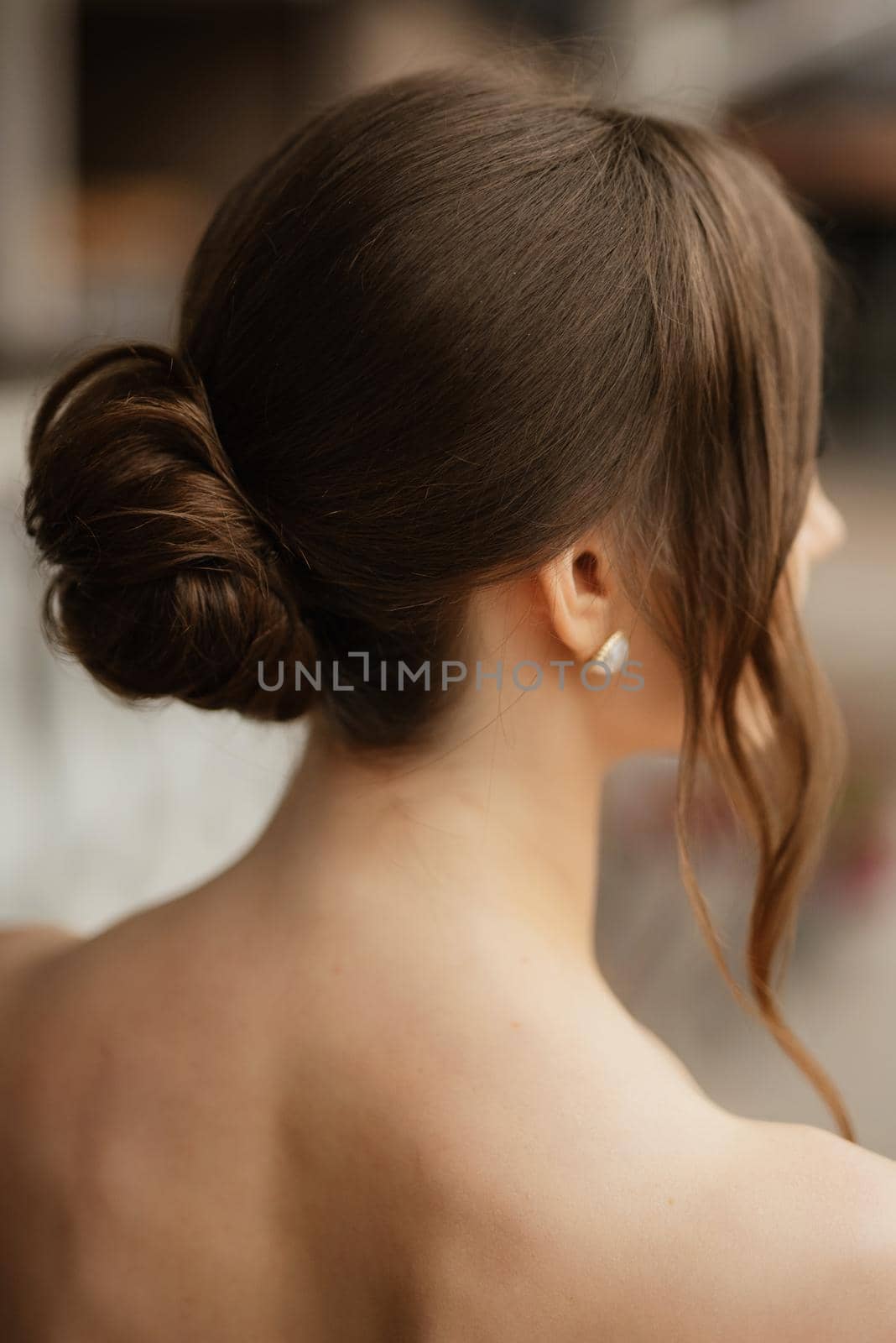 portrait of a young bride girl in a short white dress on a rainy day