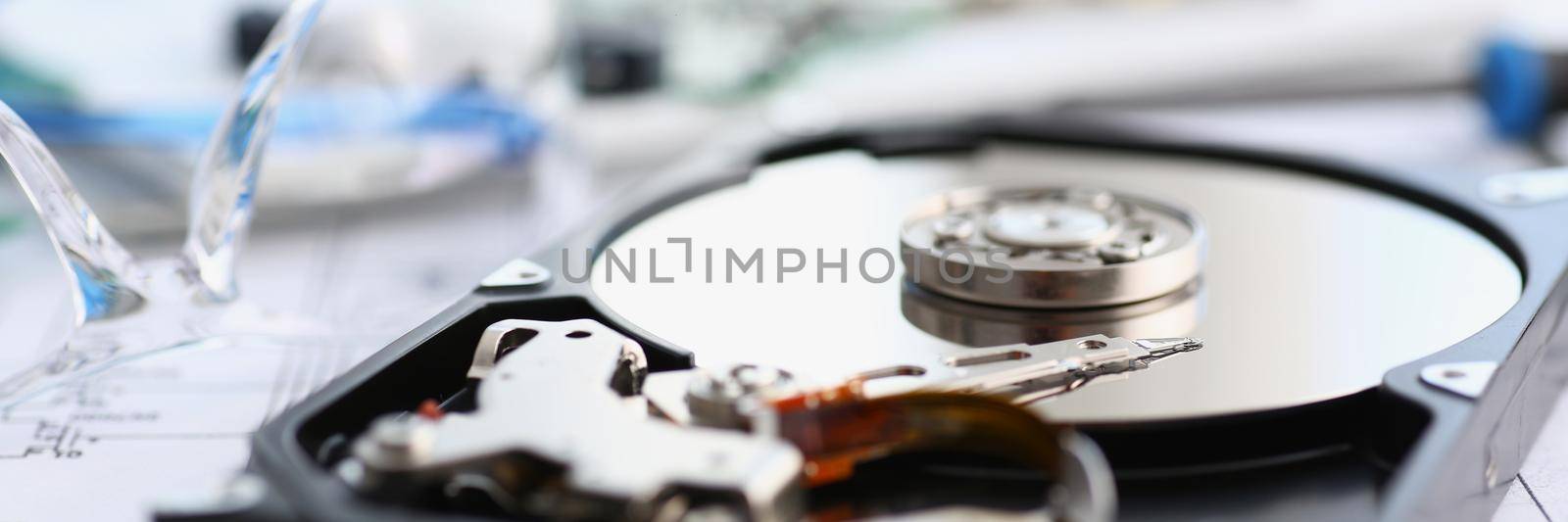 Disassembled hard drive from pc hdd and reader arm, made of plastic and metal by kuprevich
