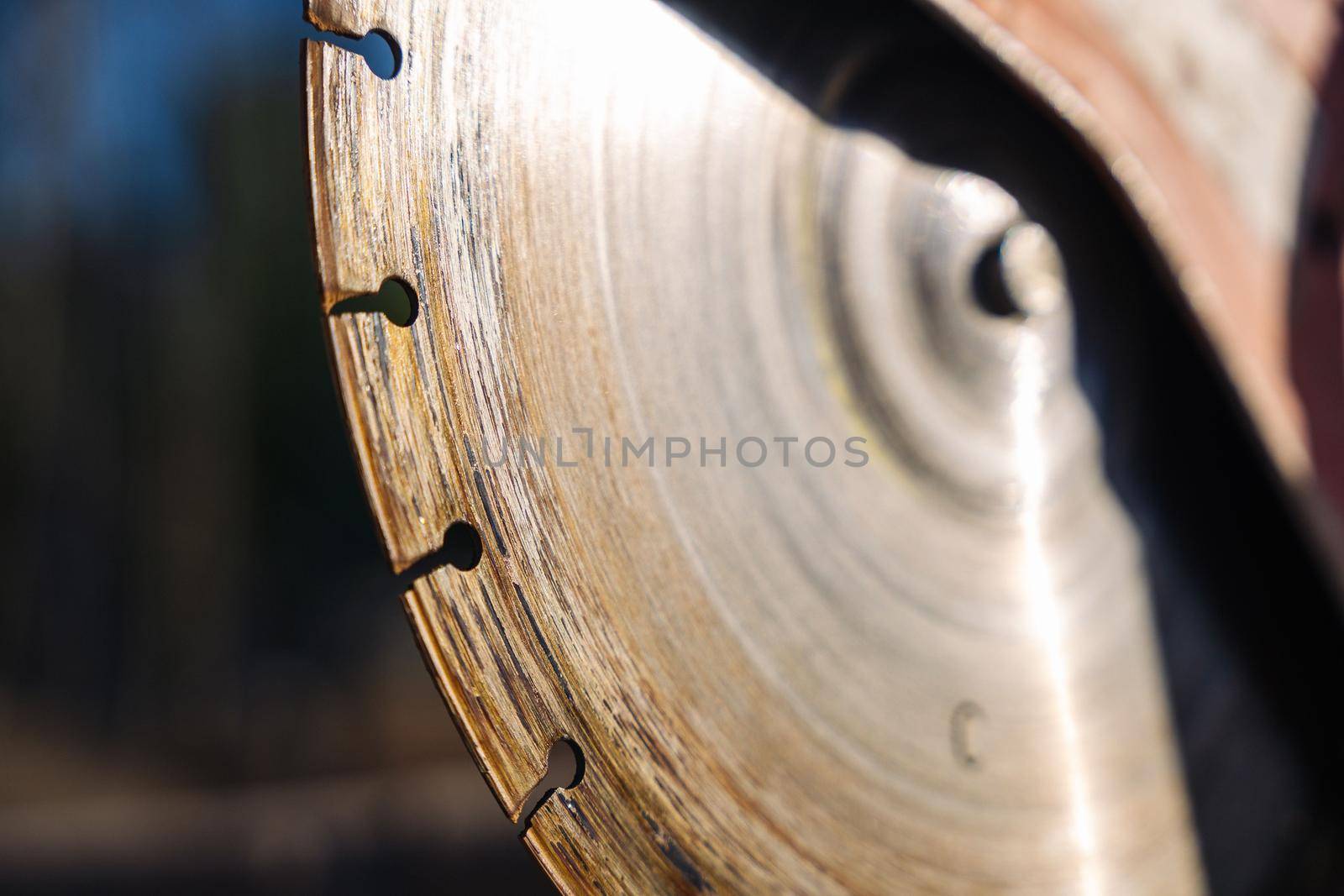 close-up of a saw with a disc for cutting concrete and paving slabs. gasoline hand saw on concrete