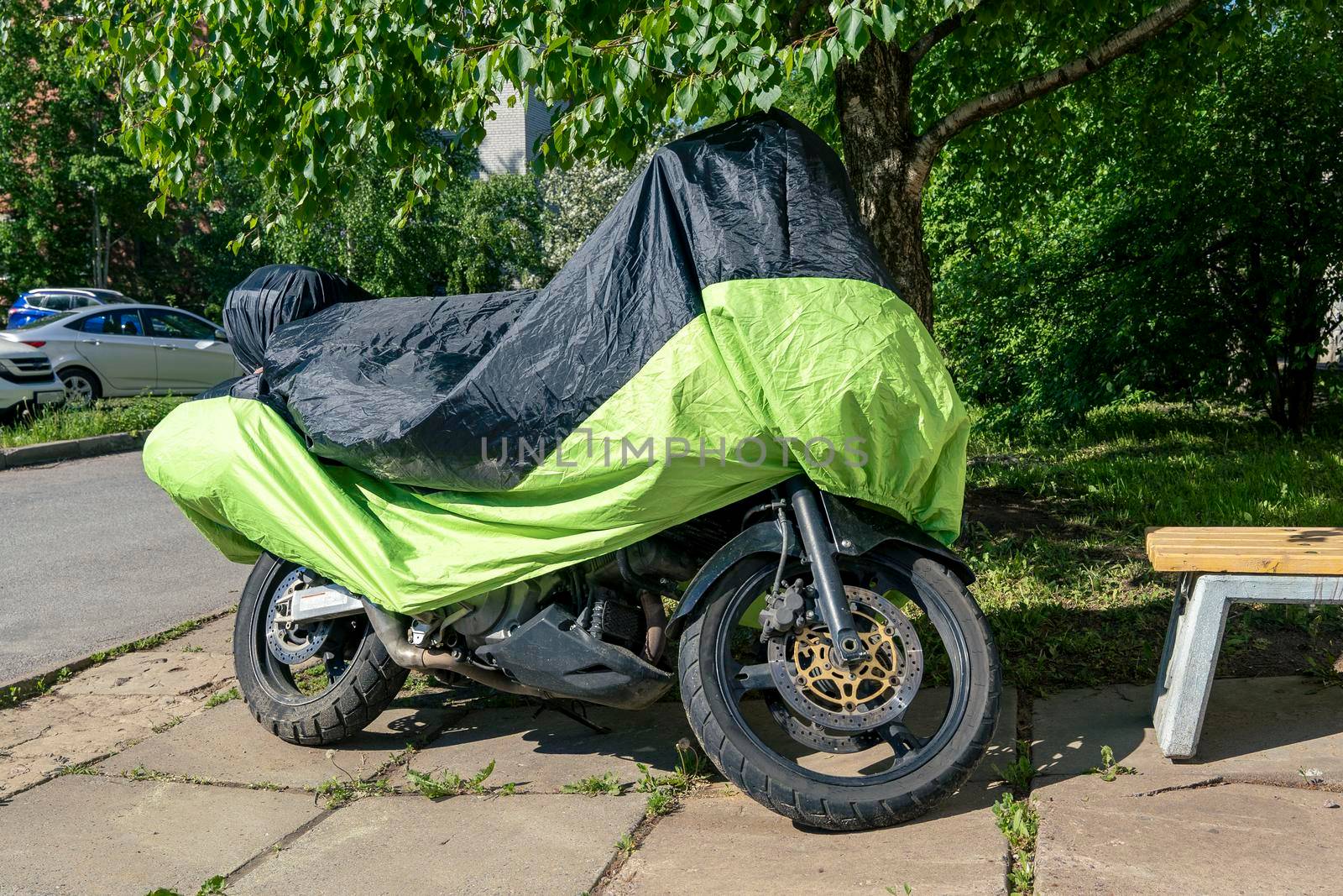 motorcycle in the parking lot in the yard covered with a rain cover by audiznam2609