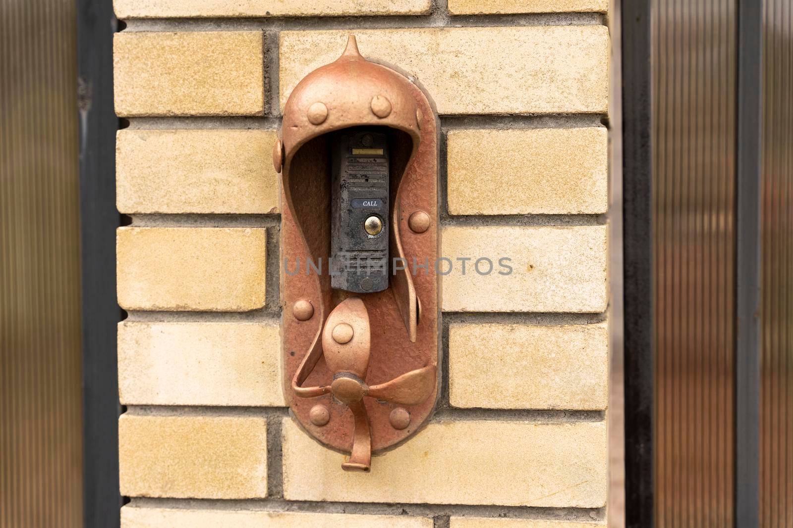 intercom panel with a video camera on the brick fence of private house by audiznam2609