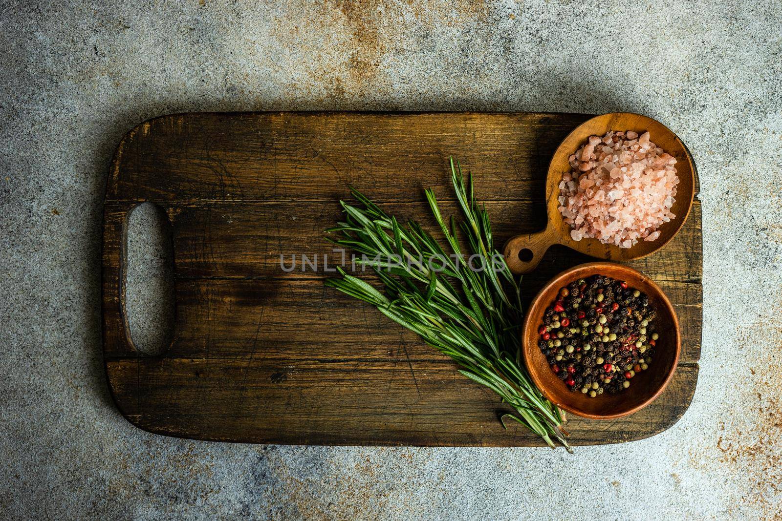 Cooking concept with spices on concrete background by Elet