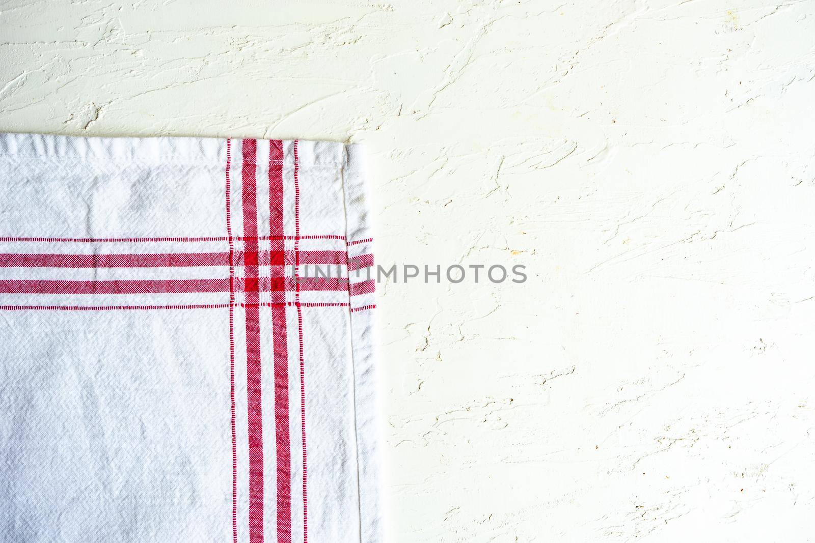 Kitchen textile towel on concrete table background with copy space