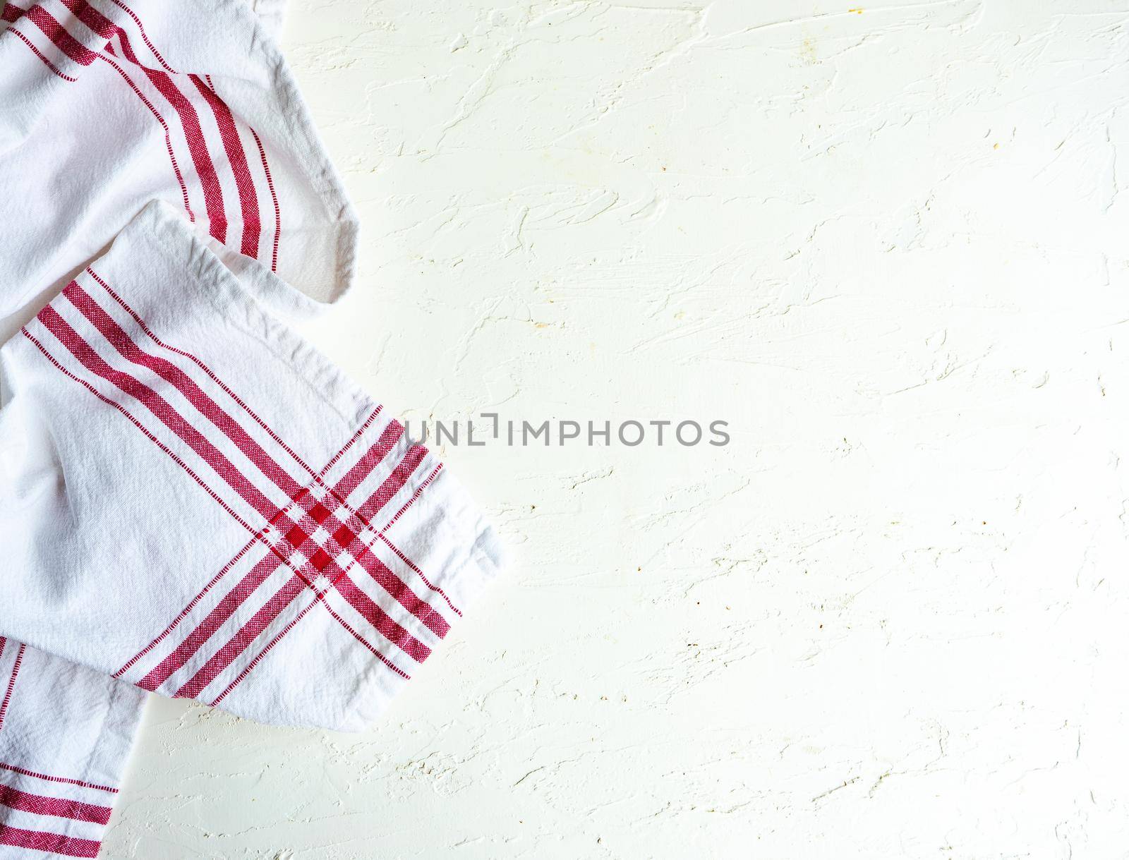 Kitchen textile towel on concrete table background with copy space
