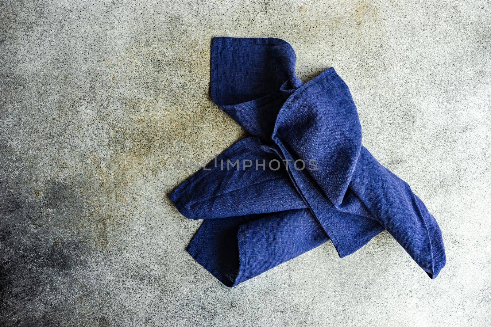 Kitchen textile towel on concrete table background with copy space