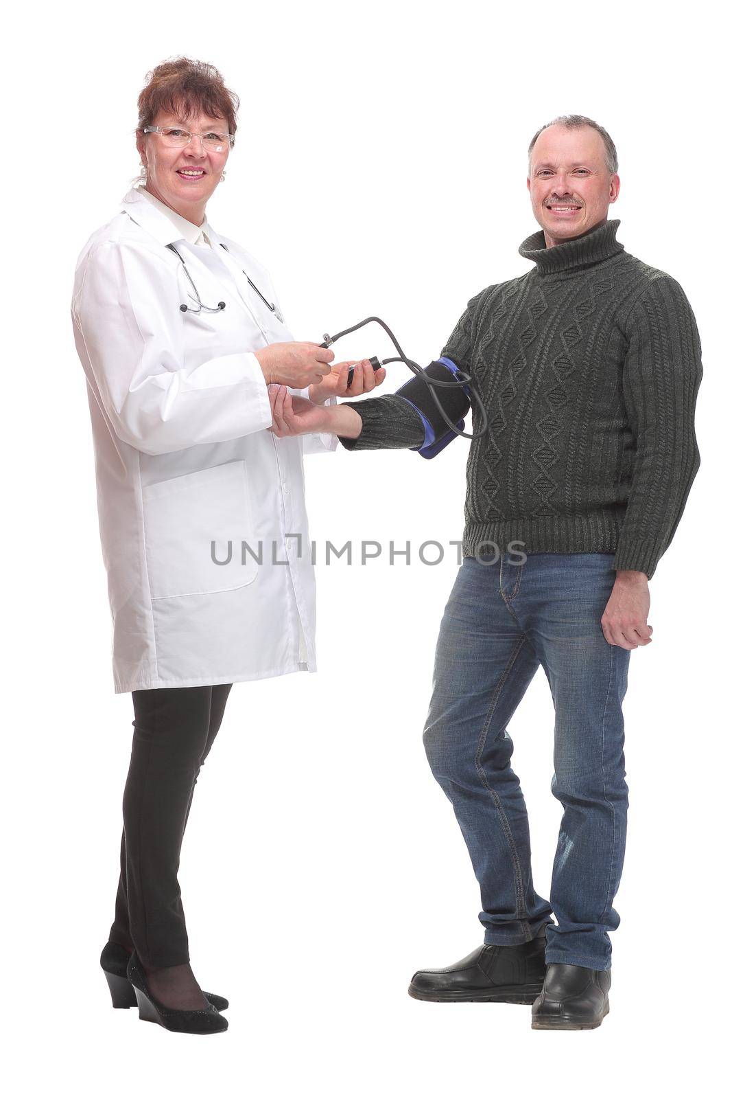 Senior smiling cheerful female medicine doctor measuring blood pressure to patient by asdf