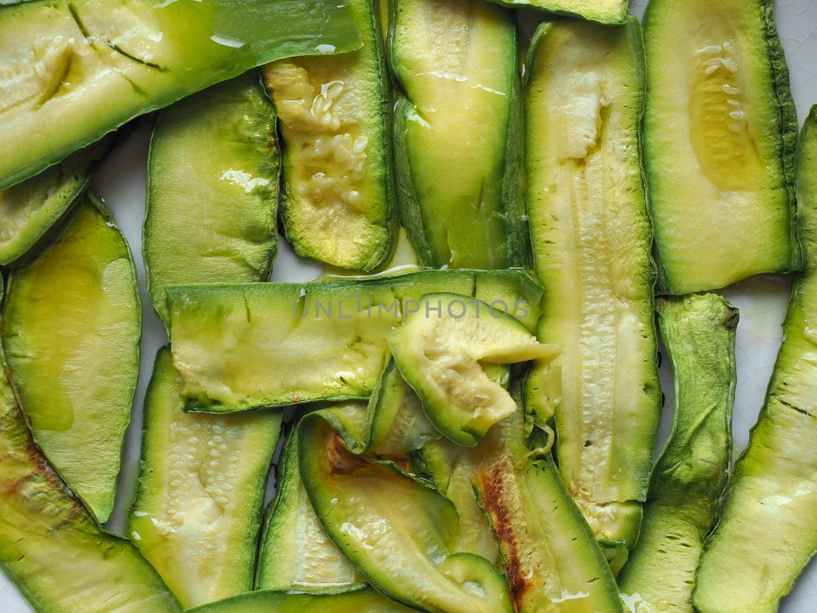 zucchini aka courgettes vegetables food background by claudiodivizia