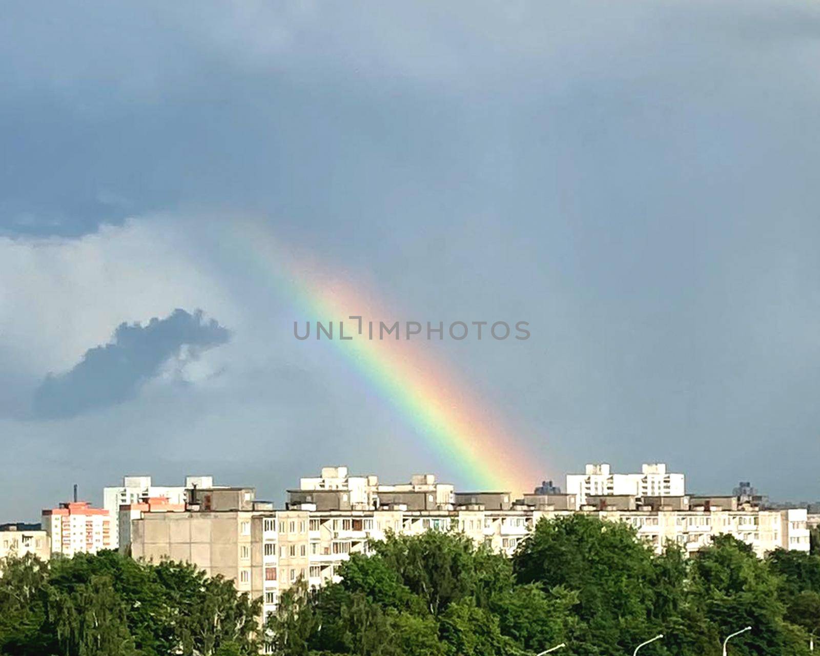 Rainbow over the city. High quality photo