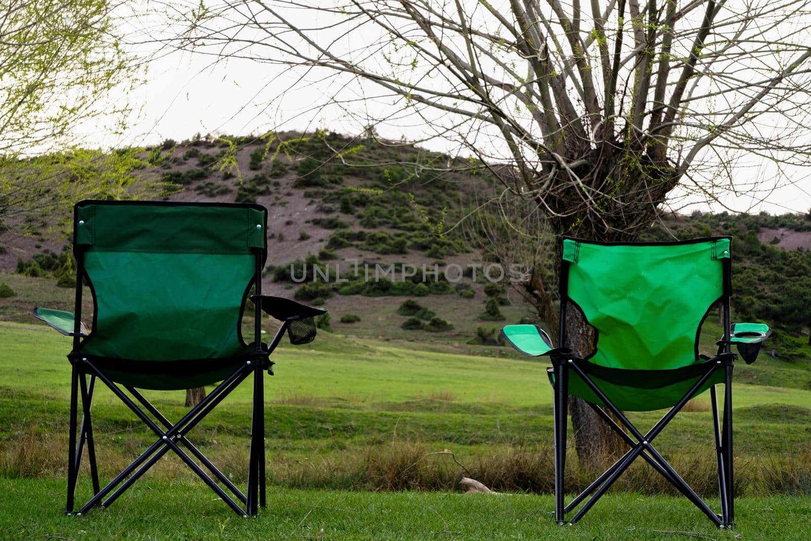 Two collapsible chairs in the nature