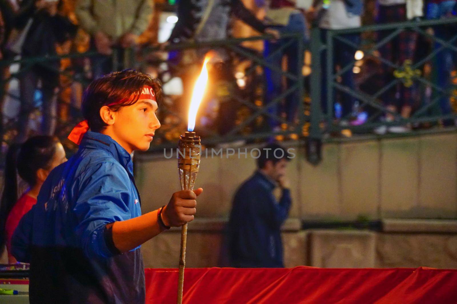 19 May 2019 Eskisehir Turkey. Young boy holding fire torch that symbolises the independence of Turkish nation on 19 May National Independence Parade
