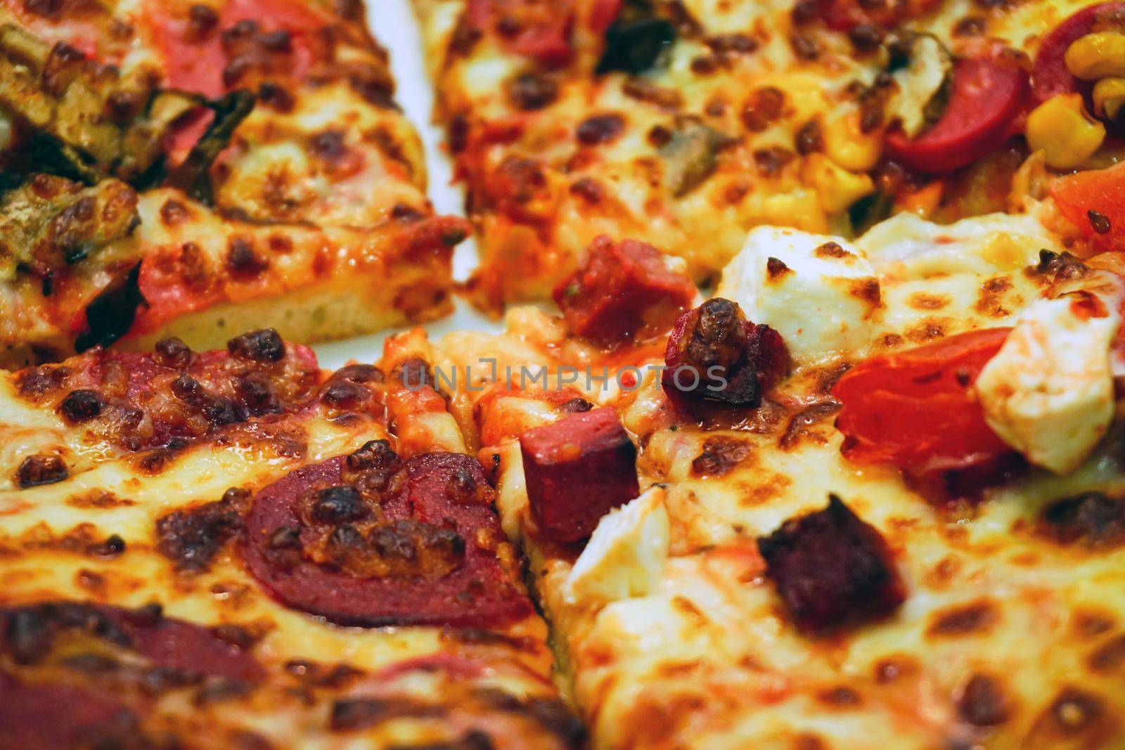 Homemade pizza and french fries on wooden table