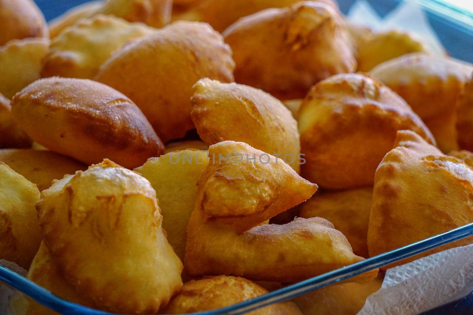 Leavened dough pastry on glass dish on wooden background with copyspace Turkish breakfast concept