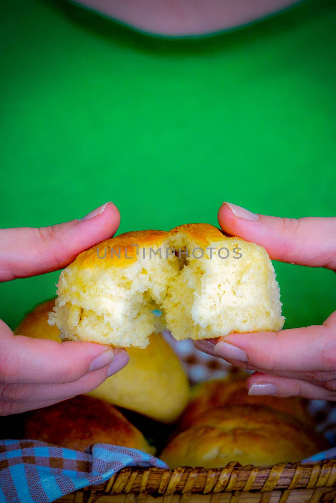 Woman spreading home made bread in hand close up view portrait image