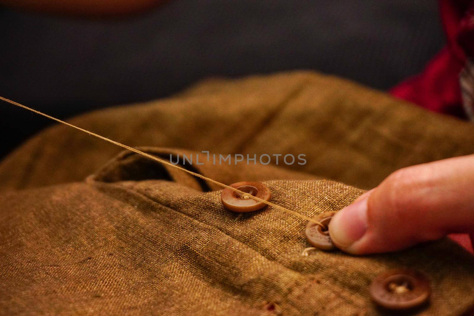 Sewing button handcraft close up view by tasci