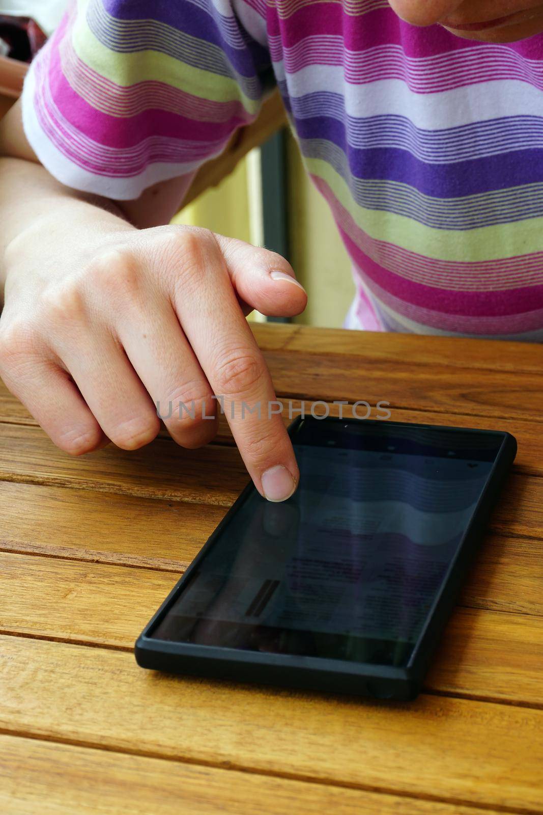 Touching the smartphone screen with finger