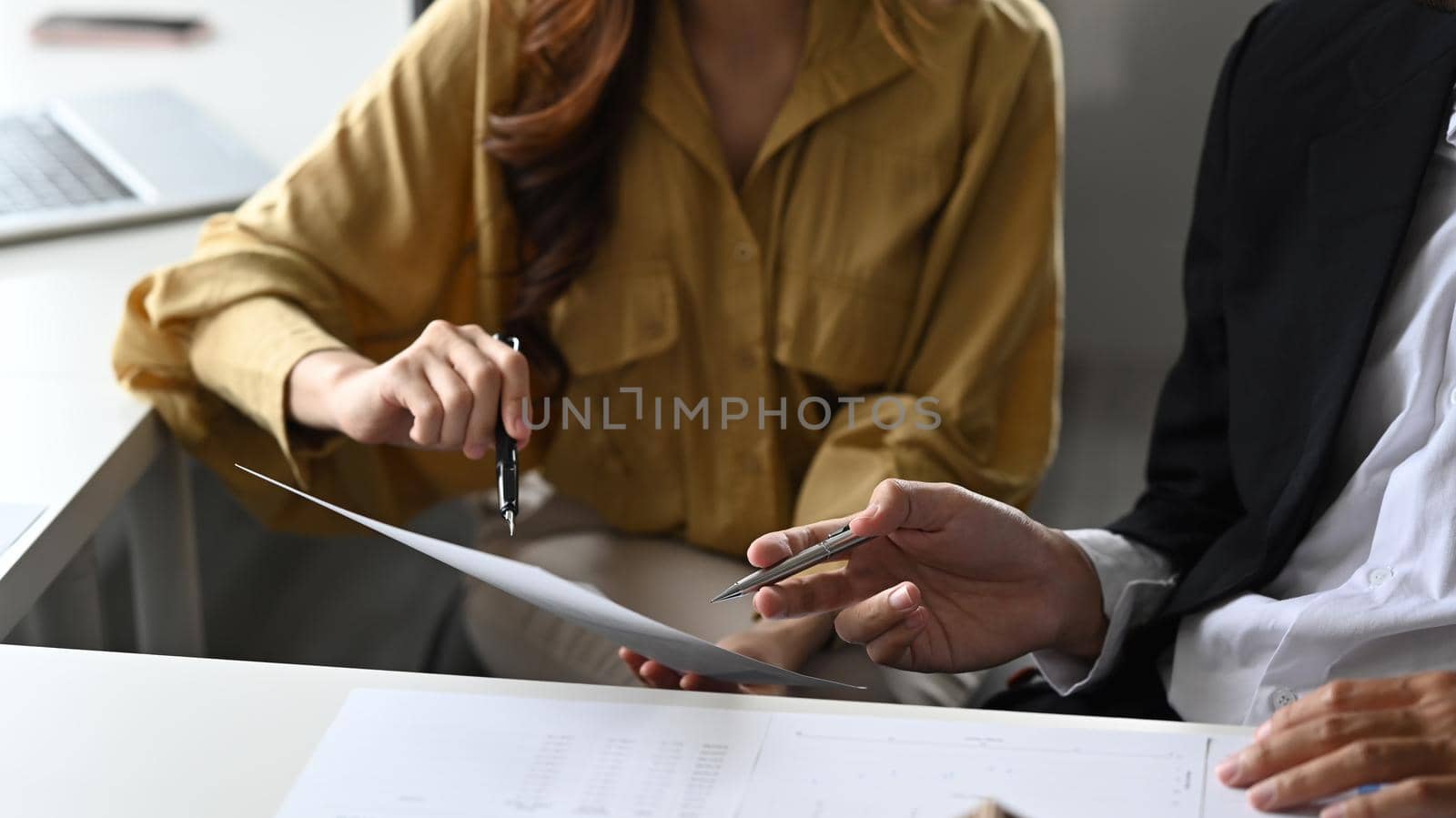 Cropped shot of two businesspeople sharing business ideas, discussing for new strategy of development together.