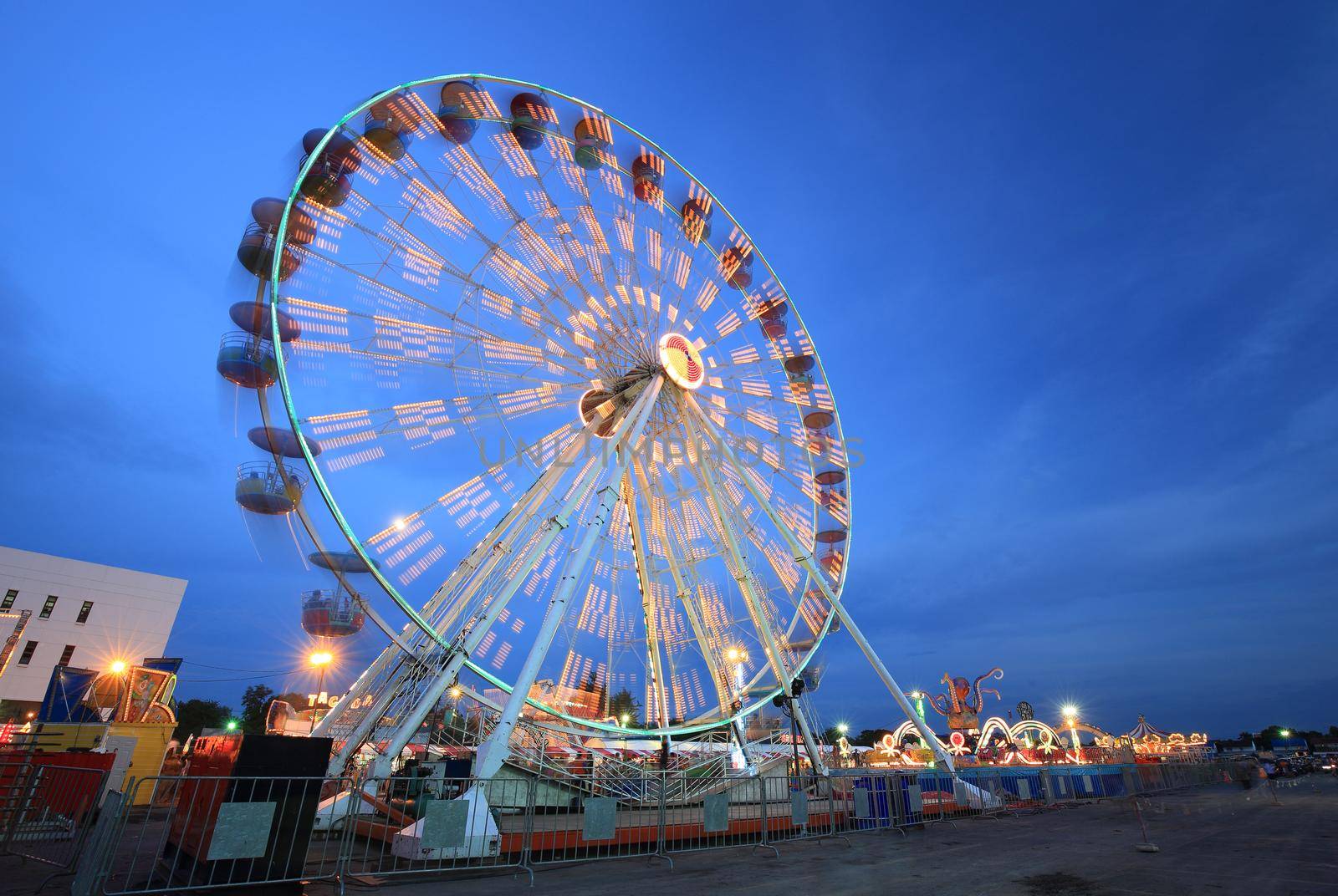 Ferris Wheel(motion) at amusement park at twilight time