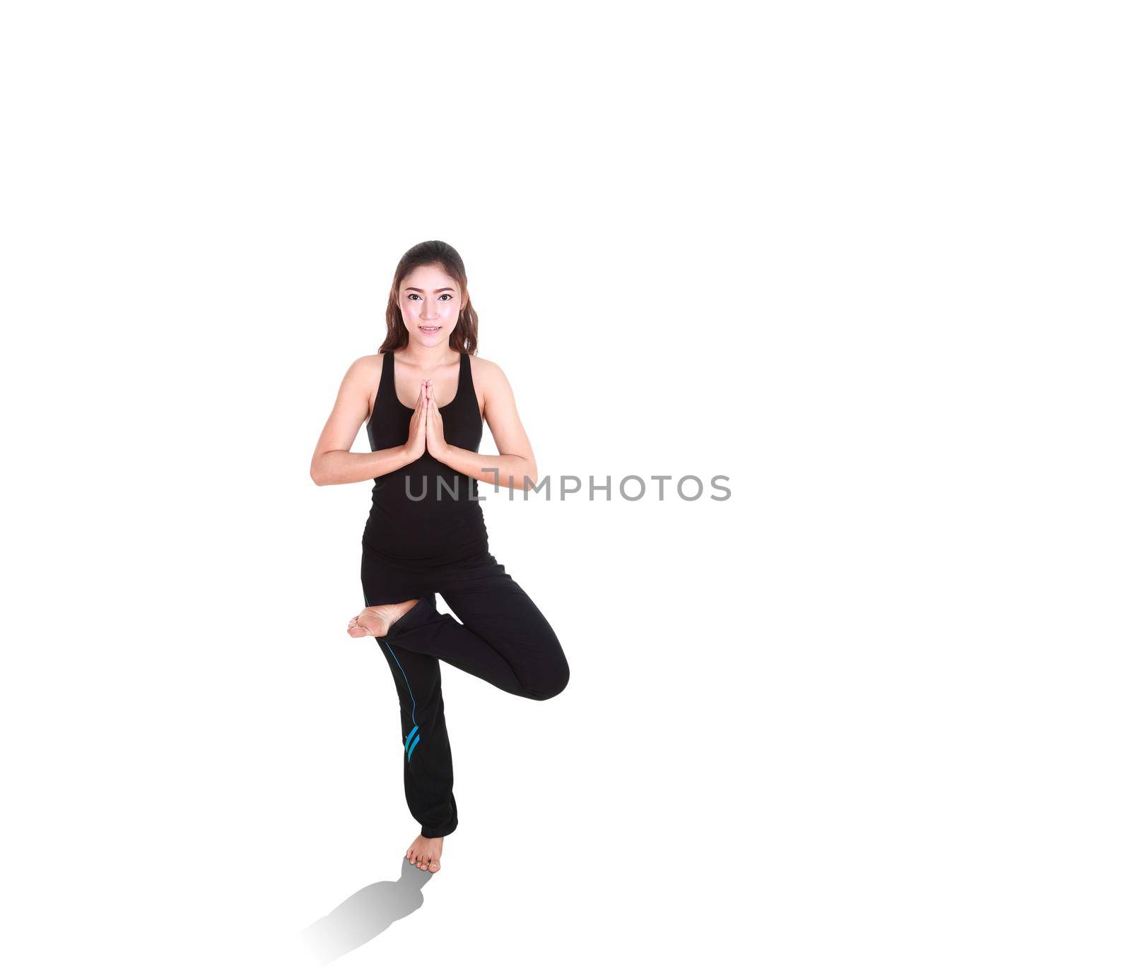 Young woman doing yoga exercise isolated on white background