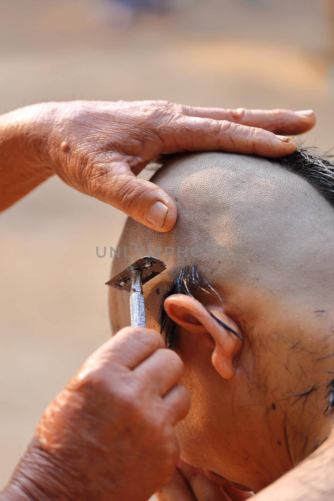 Male who will be monk shaving hair for be Ordained to new monk