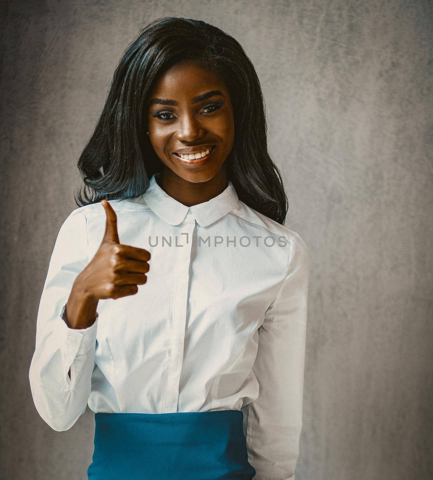 Cute African businesswoman shows thumb up Gesture, Portrait Of Cheerful Dark-Skinned Woman, Female White Collar Worker Demonstrating Thumbs Up Sign, Toned Image