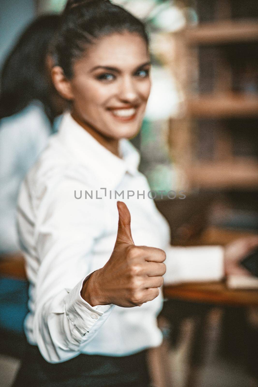 Portrait Of Cheerful Business Lady Showing Big Thumb In Approval In Office, Selective Focus On Female Hand Foreground, Close Up Shot, Toned Image