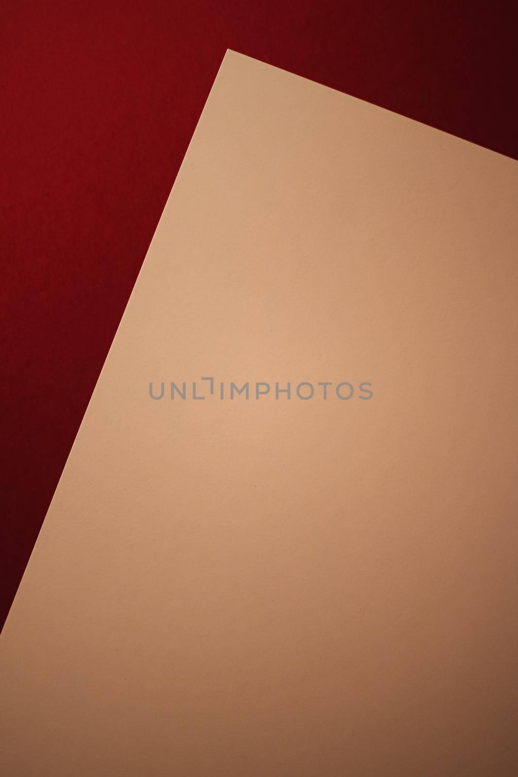 Blank A4 paper, beige on dark red background as office stationery flatlay, luxury branding flat lay and brand identity design for mockup by Anneleven