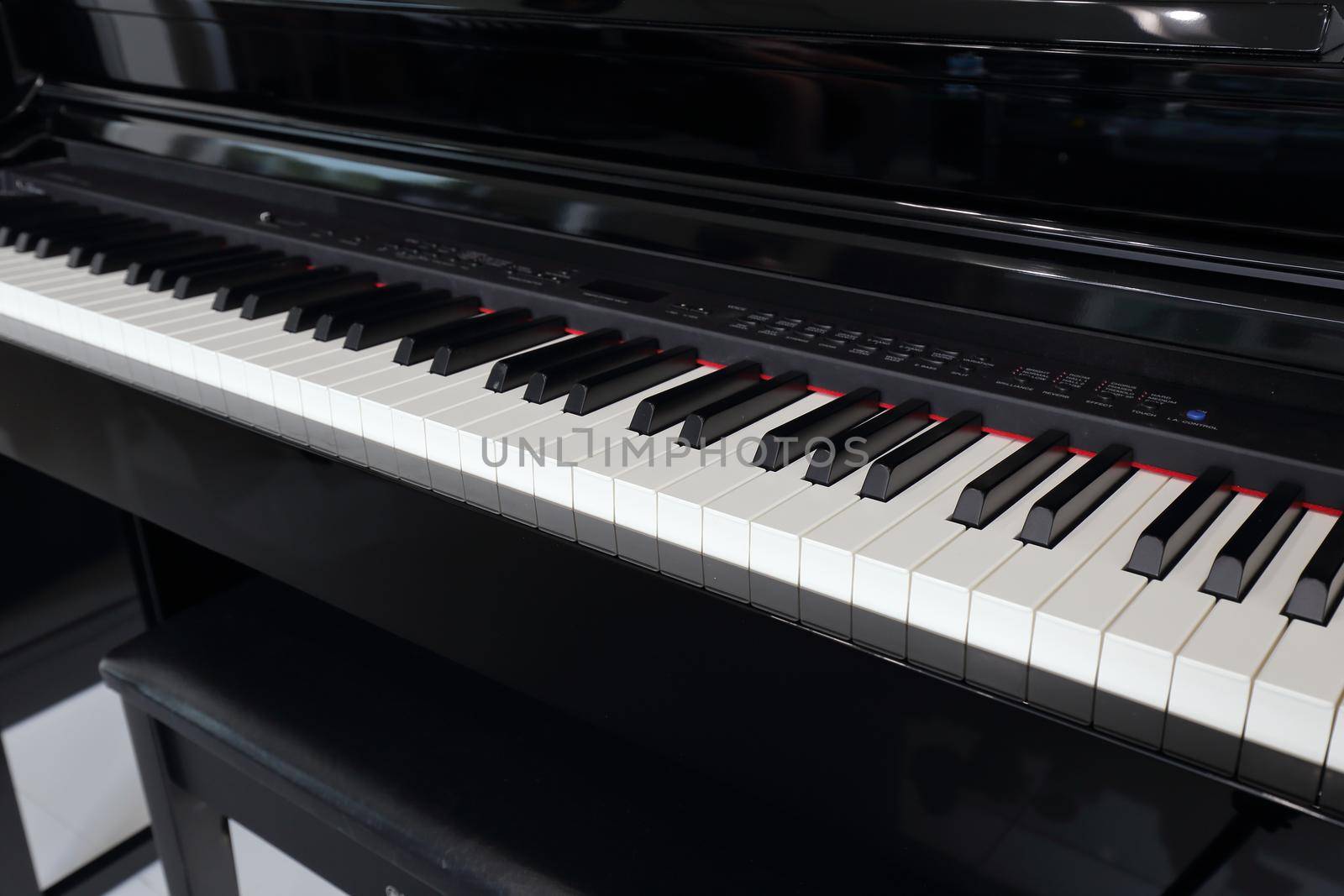 A black electronic piano with piano keys