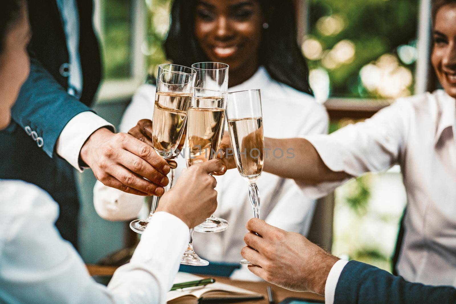 Diverse Team Combined Glasses With Champagne, Multi-Ethnic Group Of Colleagues Holding Glasses With Alcohol At Business Event, Well-Dressed Team Celebrating Successful Startup Project, Toned Image