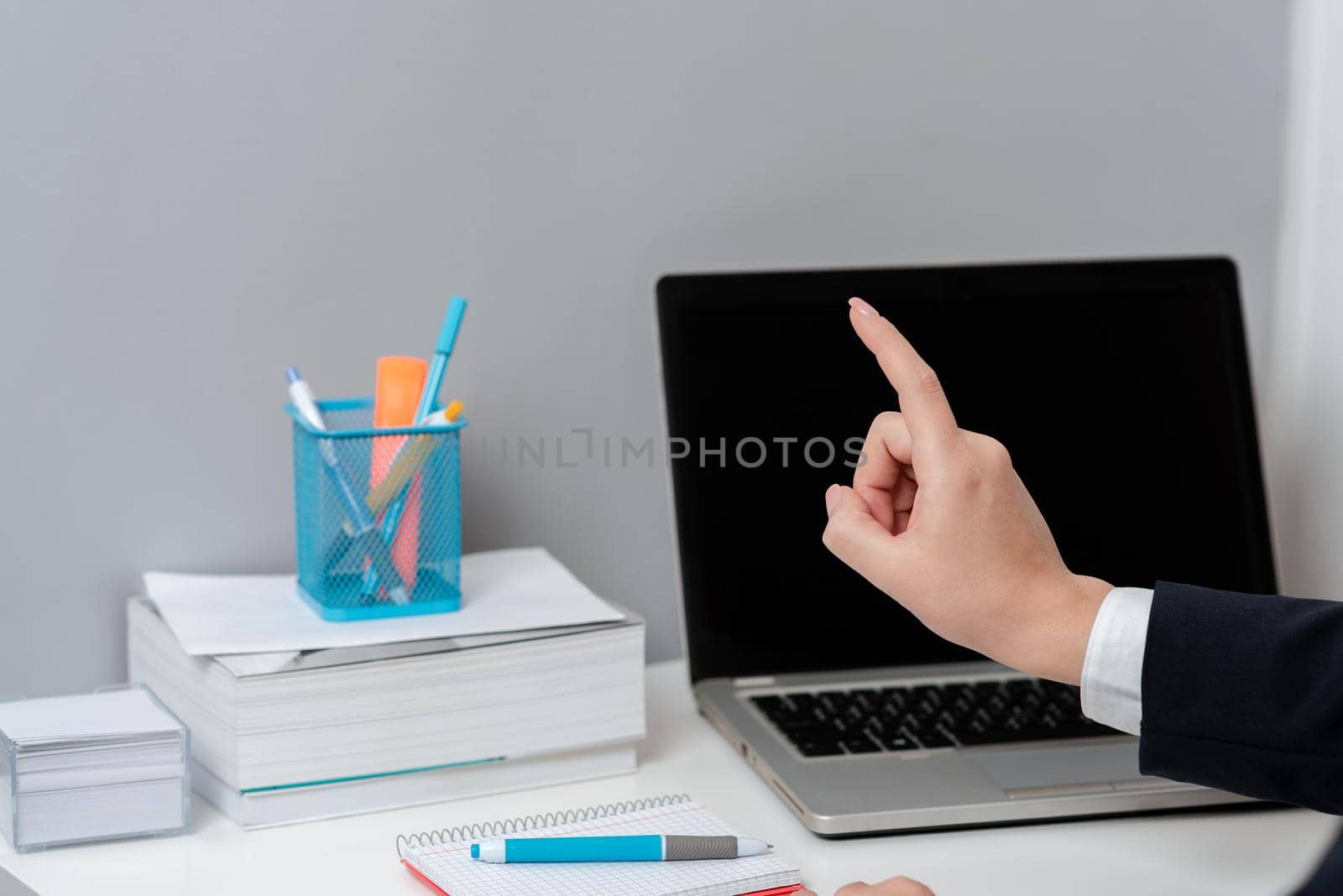 Businesswoman Pointing With One Finger On Important Message.