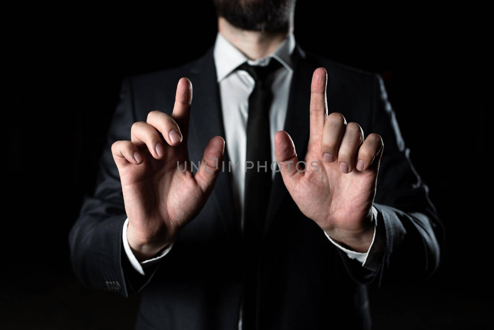 Businessman Pointing Crutial Informations With Two Fingers. Man In Suit Presenting Recent Updates. Executive Showing Important Announcements. Entrepreneur Displaying New Ideas by nialowwa