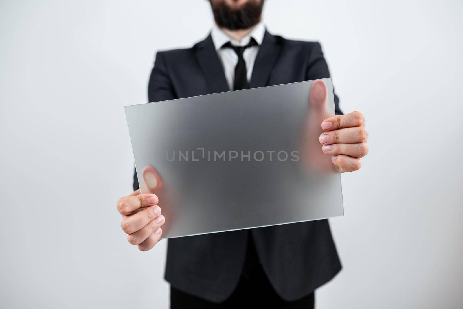 Male Professional Showing Placard And Advertising The Company.