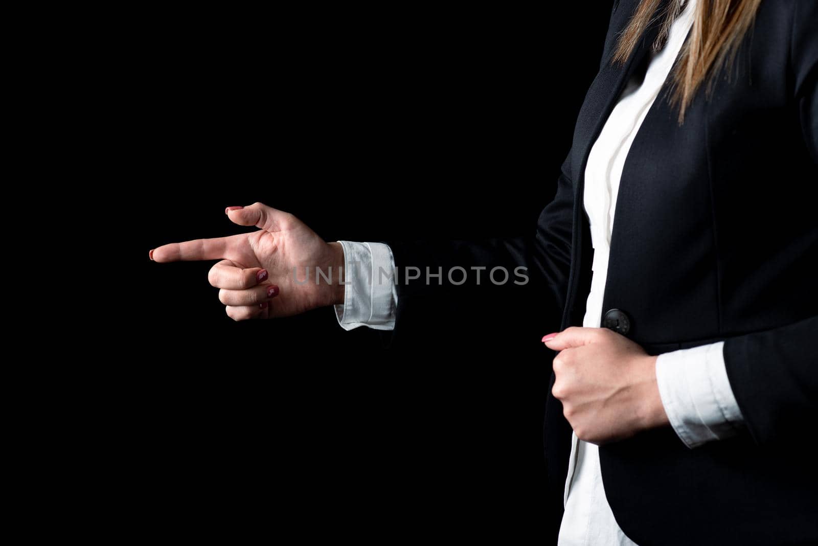 Businesswoman Pointing Important Infortmations With One Finger. Hand Presenting Crutial Announcement. Woman Showing Recent Updates. Executive Displaying Critical Messages. by nialowwa