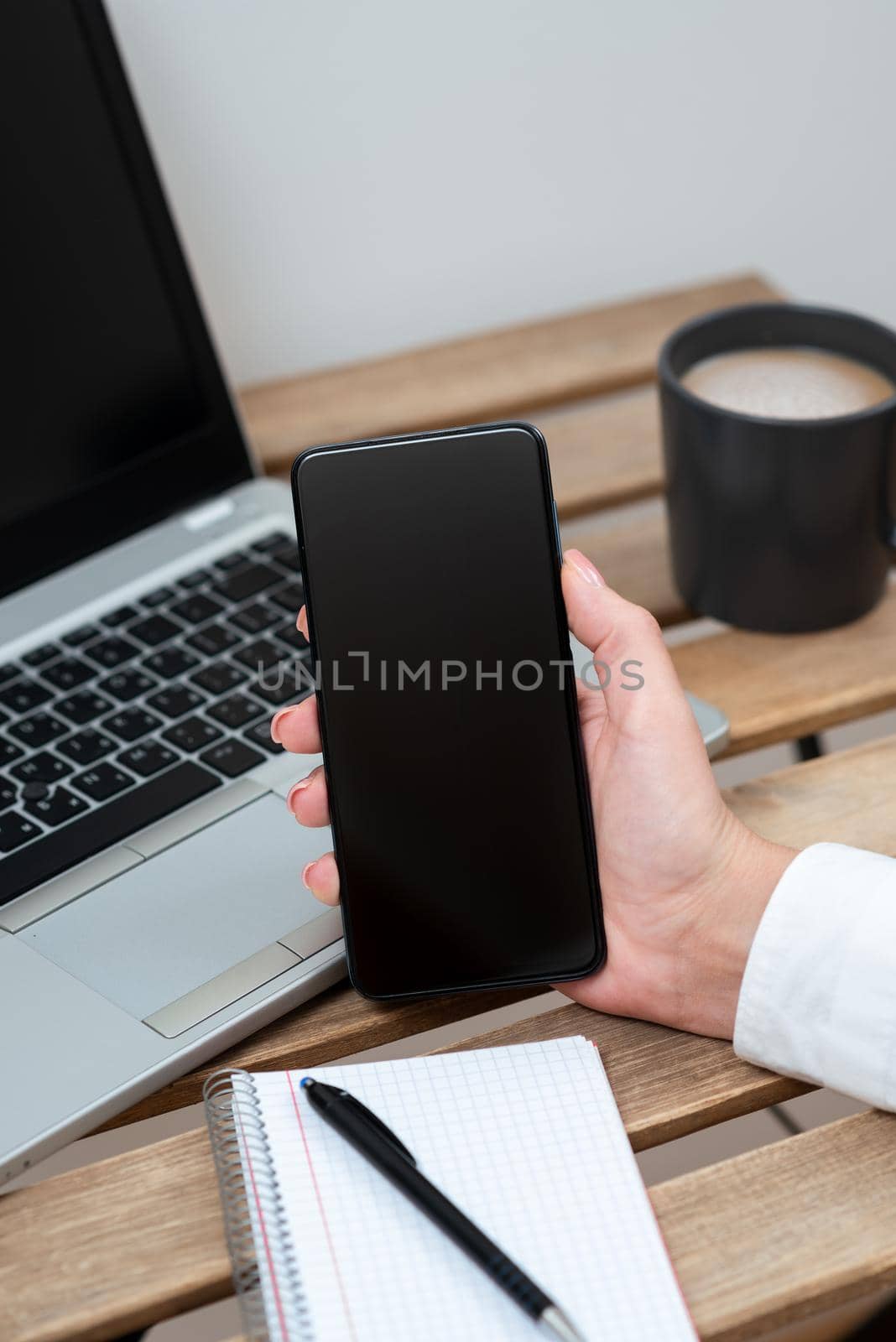 Sitting Businesswoman Holding Cellphone With Important Message.