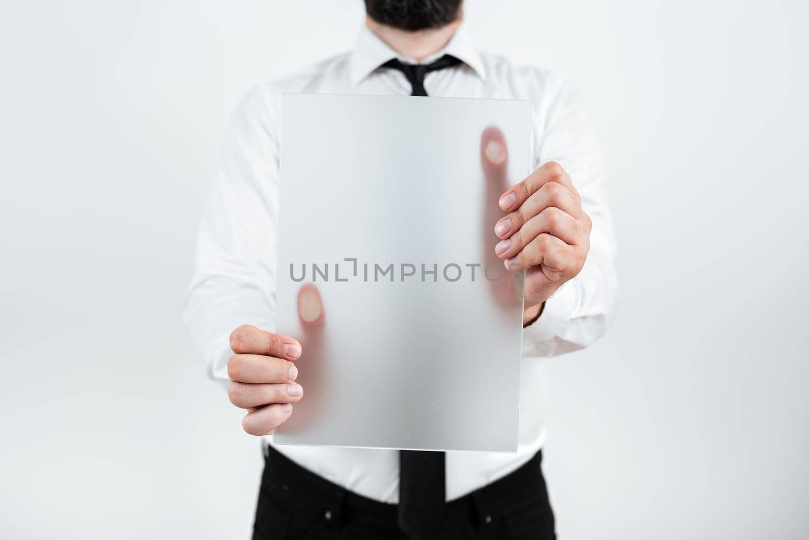 Man Holding Paper Presenting Marketing Strategies For Development.