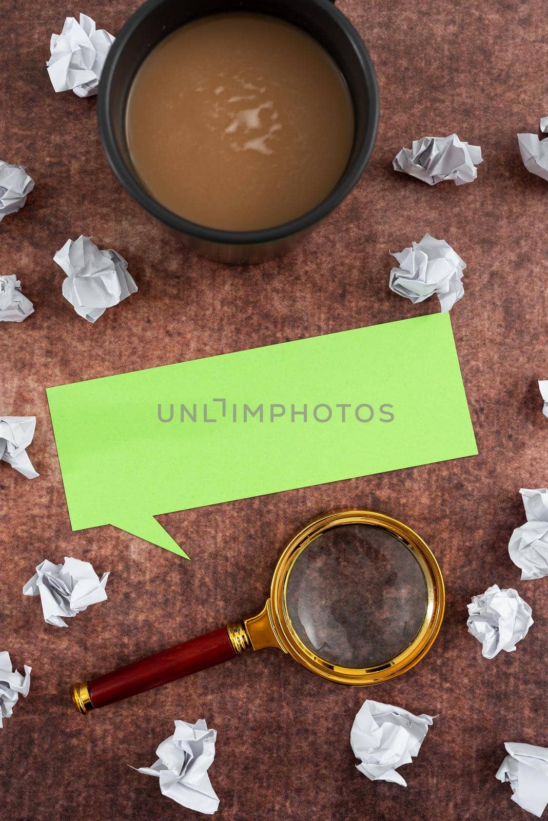 Speech Bubble Made Of Sheet With Magnifying Glass, Coffee Cup Surrounded With Crumpled Papers Over Wooden. It Is Presenting Analyzing Of Plans And Strategies For Business. by nialowwa